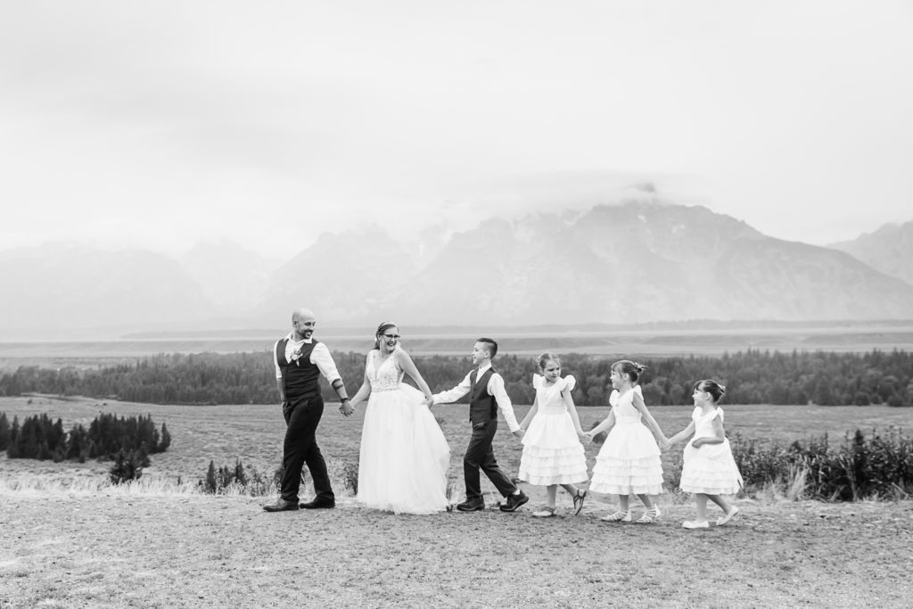 Rainy Grand Teton wedding Mountain View Turnout handfasting ceremony