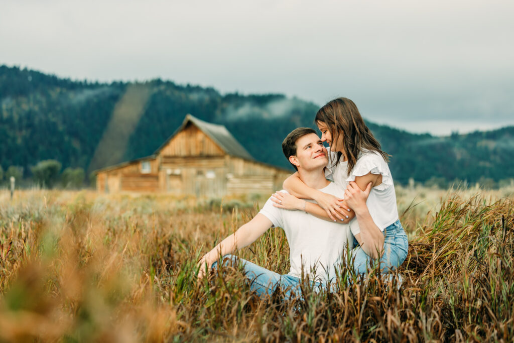 Mormon Row proposal with engaged couple in Grand Teton National Park fall morning photo session white clothes