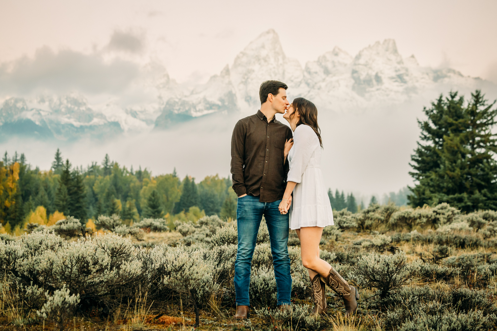 GTNP Schwabacher's Landing Engagement Couple newly proposed to with misty Teton mountain range, white dress