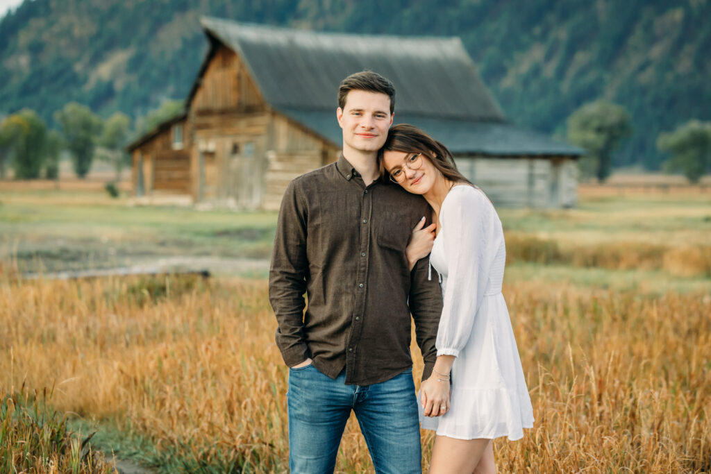 Mormon Row proposal with engaged couple in Grand Teton National Park fall morning photo session white clothes