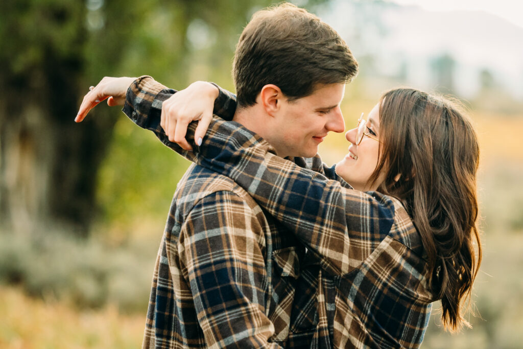 Mormon Row proposal with engaged couple in Grand Teton National Park fall morning photo session white clothes