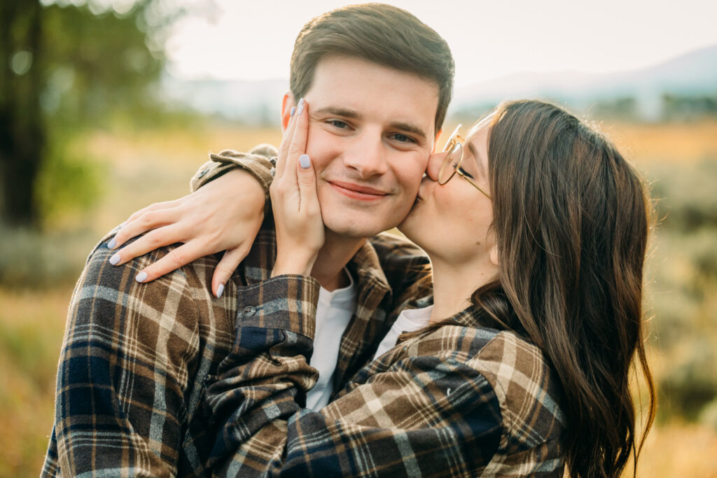 Mormon Row proposal with engaged couple in Grand Teton National Park fall morning photo session white clothes