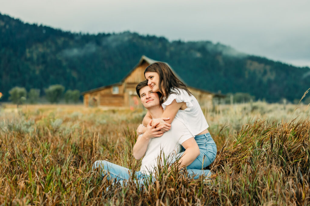 Mormon Row proposal with engaged couple in Grand Teton National Park fall morning photo session white clothes