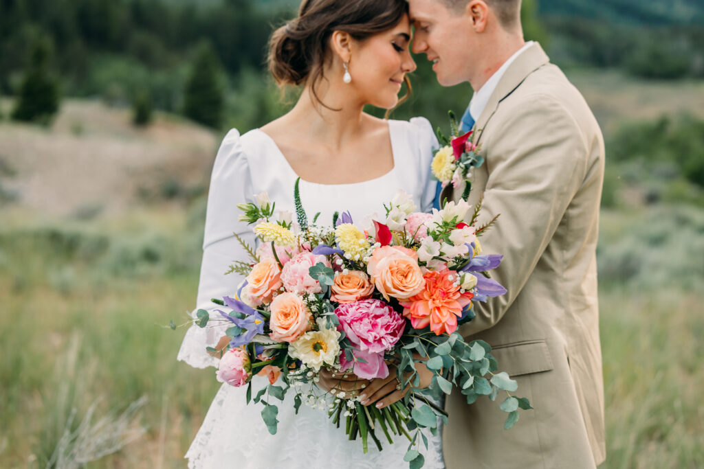 Jackson Hole wedding florist arranging wildflowers