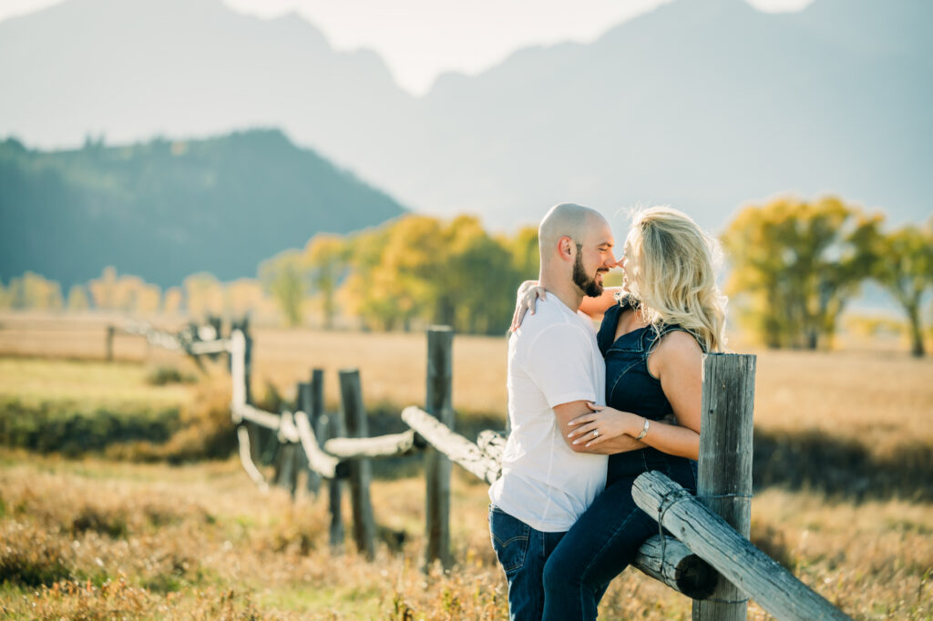 Couple posing for engagement photos in Grand Teton National Park