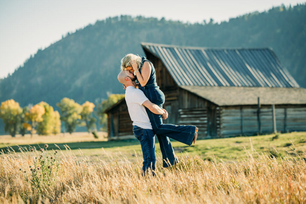 Couple posing for engagement photos in Grand Teton National Park