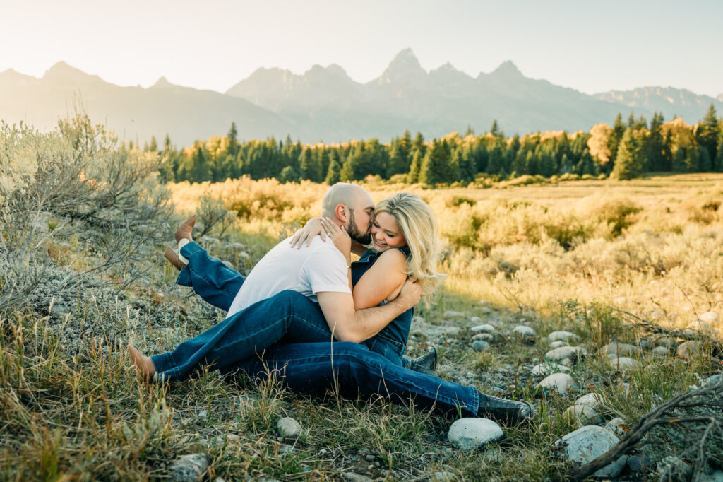 Couple posing for engagement photos in Grand Teton National Park