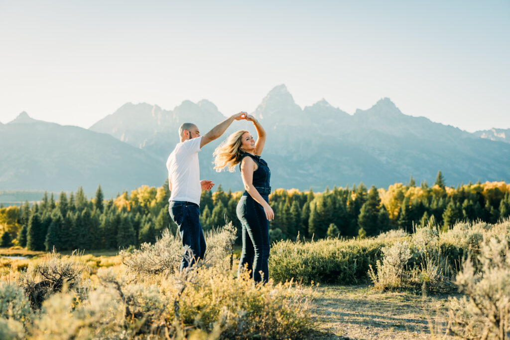 Couple posing for engagement photos in Grand Teton National Park