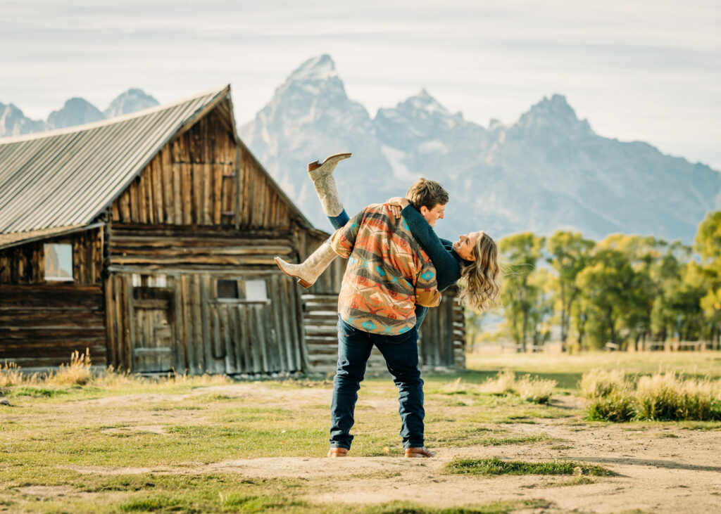 Mormon Row couple portraits engagements June tall grass T.A. Moulton Barn Grand Teton National park
