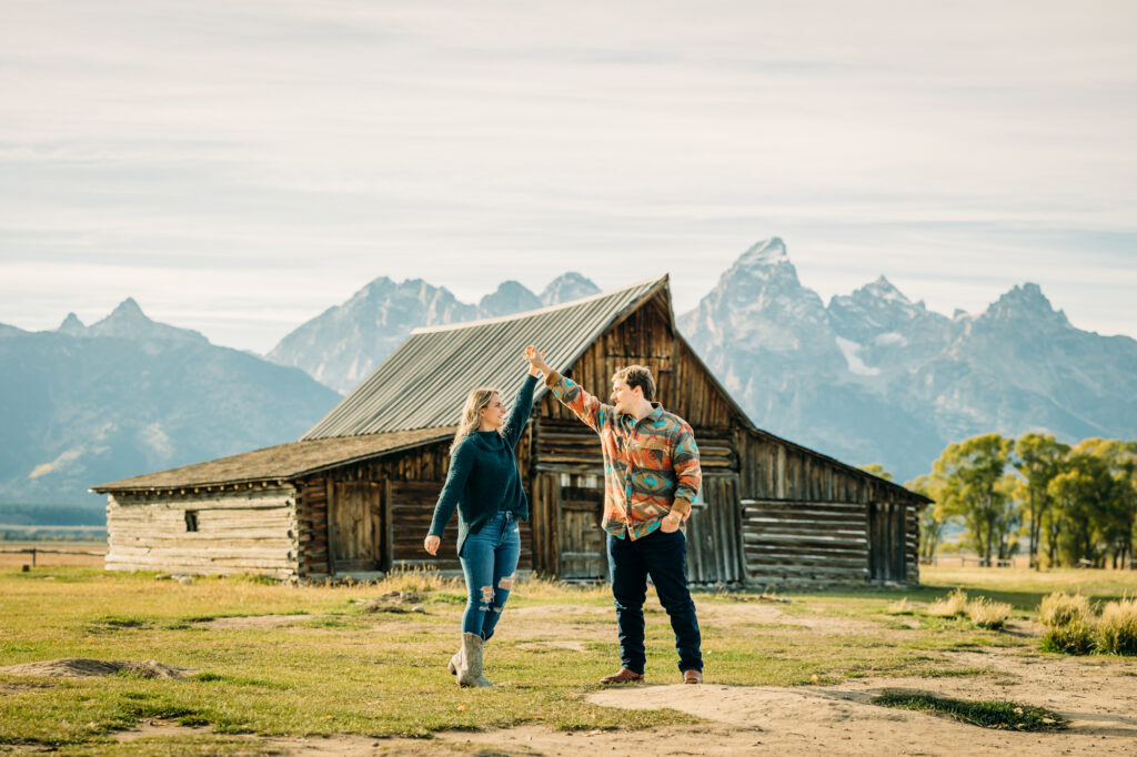 Mormon Row couple portraits engagements June tall grass T.A. Moulton Barn Grand Teton National park