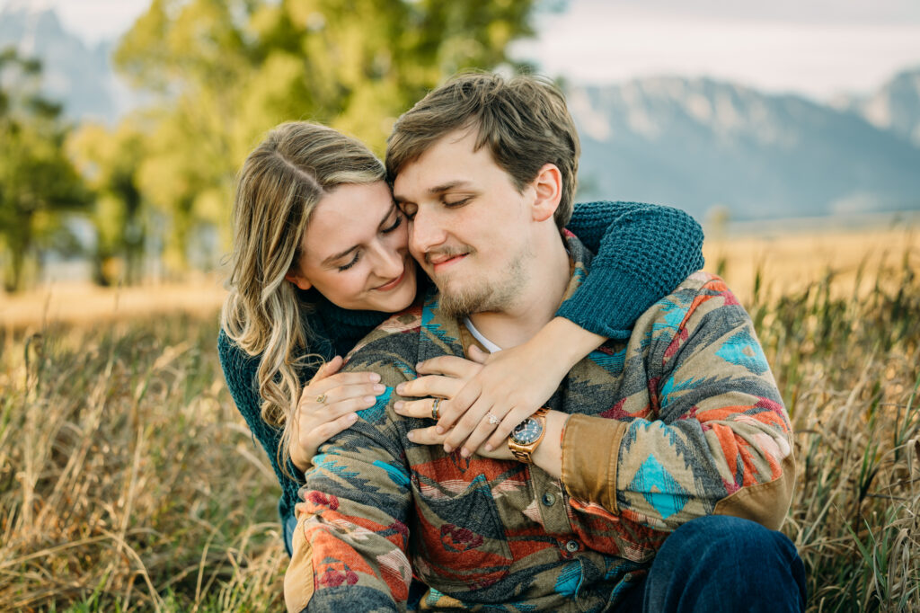 Mormon Row couple portraits engagements June tall grass T.A. Moulton Barn Grand Teton National park