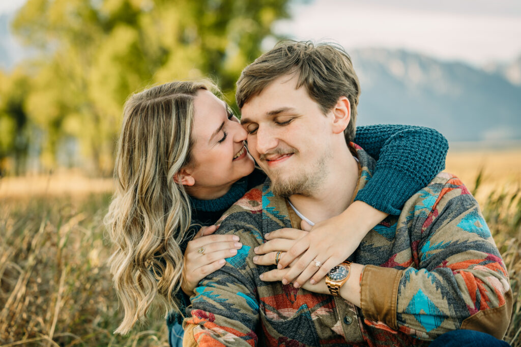 Mormon Row couple portraits engagements June tall grass T.A. Moulton Barn Grand Teton National park