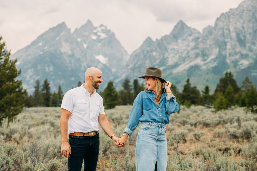 Extended family portrait with Grand Teton mountains at Cathedral Group Turnout