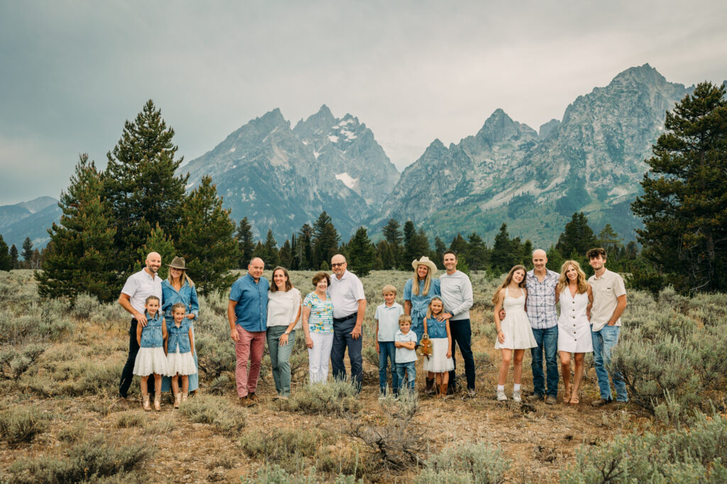 Family portrait with Grand Teton mountains at Cathedral Group Turnout