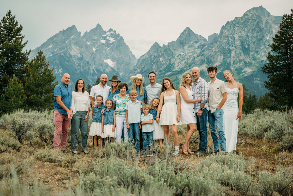 Family portrait with Grand Teton mountains at Cathedral Group Turnout