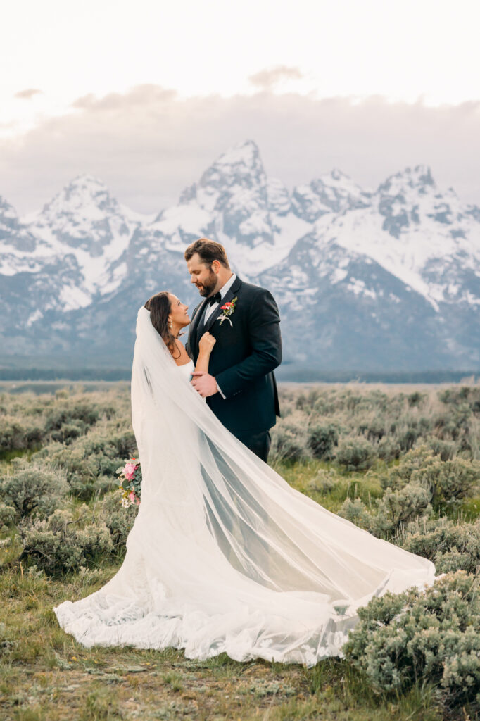 Schwabacher's Landing couple wedding photography with Snake River at sunset spring couple posing