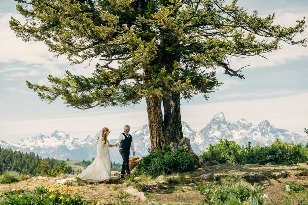 Elopement ceremony at The Wedding Tree with Grand Teton mountains in the background