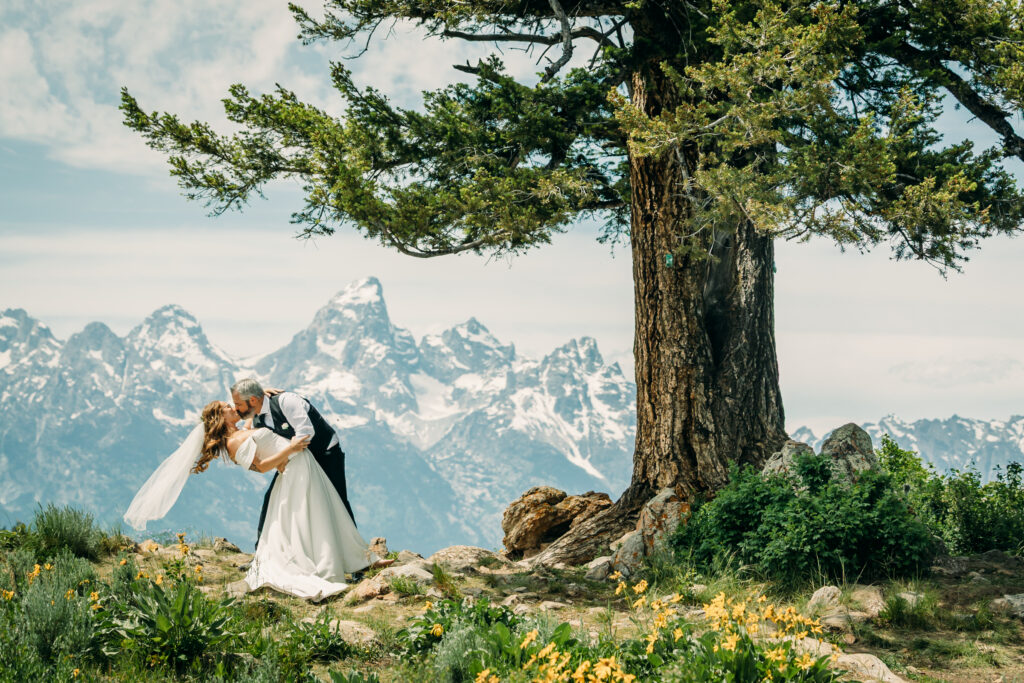Elopement ceremony at The Wedding Tree with Grand Teton mountains in the background