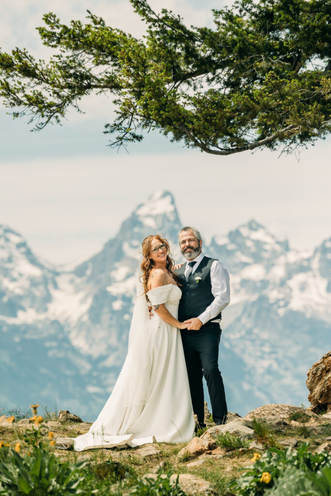 Elopement ceremony at The Wedding Tree with Grand Teton mountains in the background