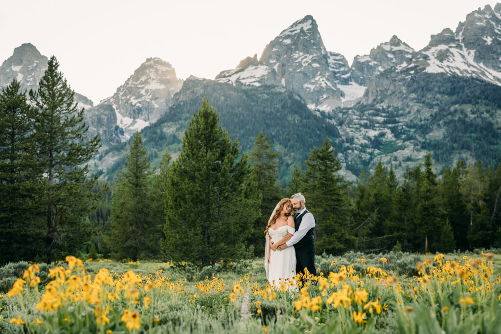 Bride and groom laughing during adventurous Grand Teton National Park elopement