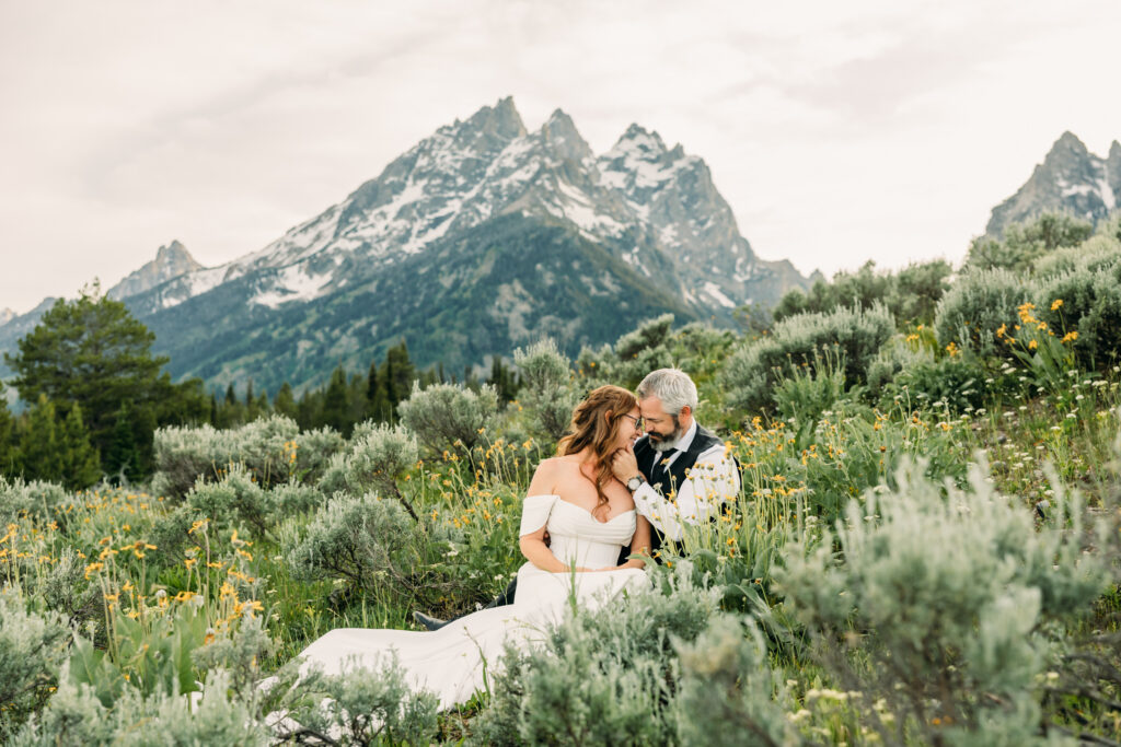 Bride and groom laughing during adventurous Grand Teton National Park elopement