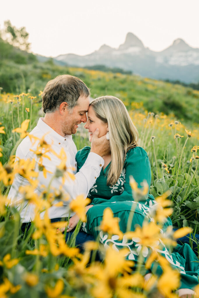 Grand Teton National Park family photographer capturing soft morning light over the mountains and a joyful family.