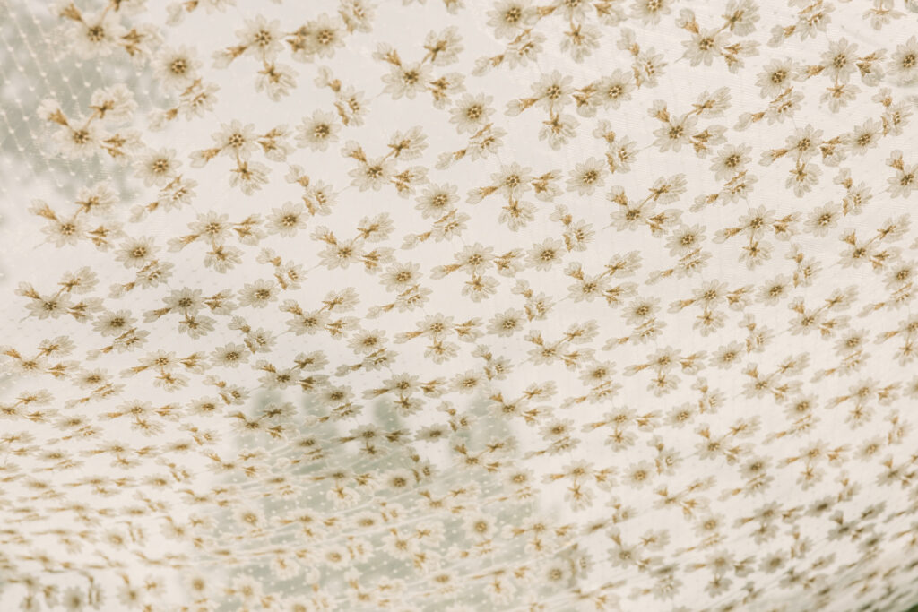 Bride and groom exchanging vows beneath The Wedding Tree overlooking the Tetons in Grand Teton National Park