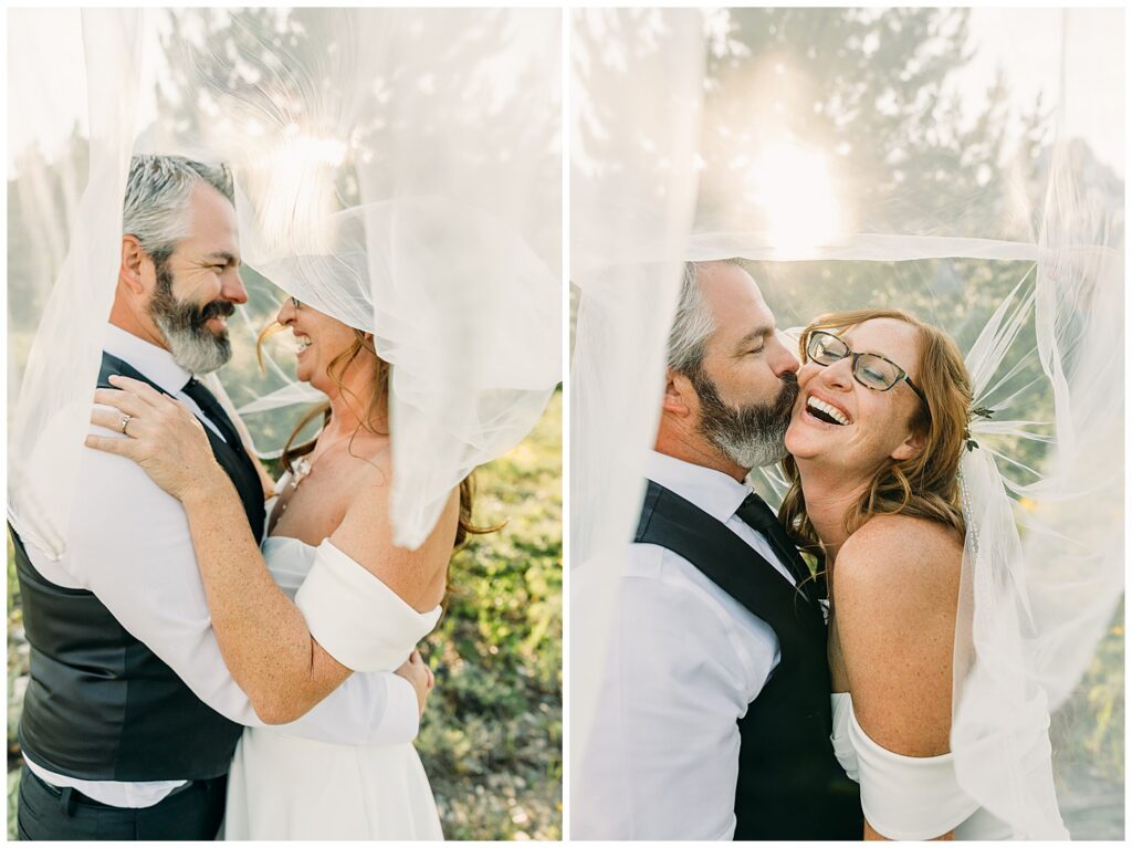 Couple kissing with dramatic mountain backdrop in Grand Teton National Park