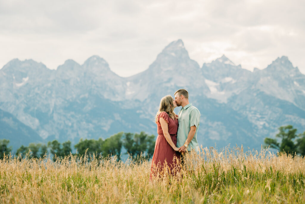 Inspiration Guide for Top 5 Locations  to take photos in Grand Teton National Park couple in front of mountains