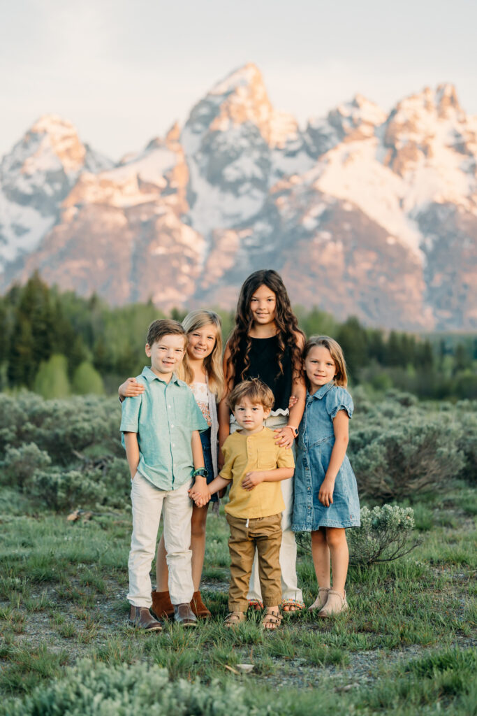 Grand teton family photographer tickling fight