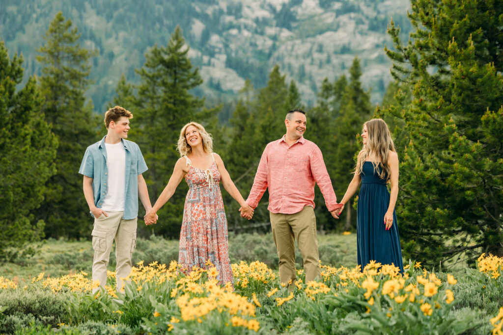 Sunset family photos with the Teton mountains in Grand Teton National Park in June with the sunflowers