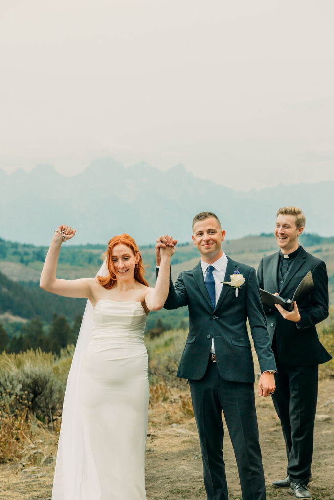 Eloping couple with the Teton mountain range in Grand Teton National Park