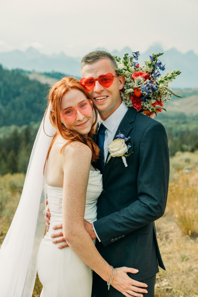 Eloping couple with the Teton mountain range in Grand Teton National Park
