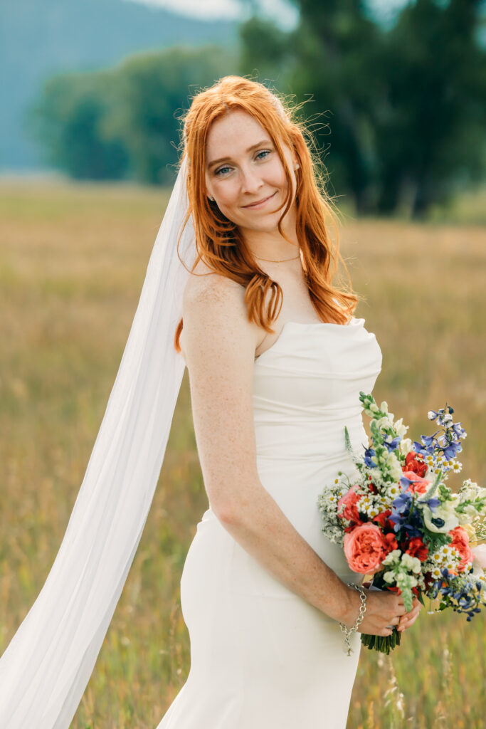 Bride and groom celebrating their Jackson Hole elopement with mountain views