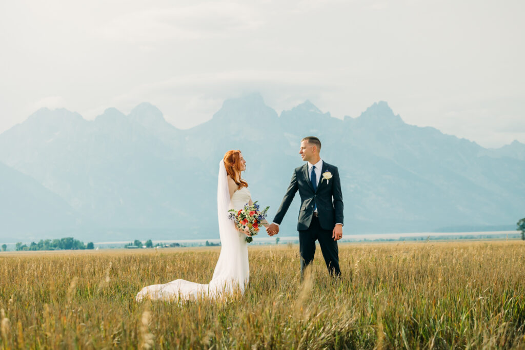 Bride and groom celebrating their Jackson Hole elopement with mountain views