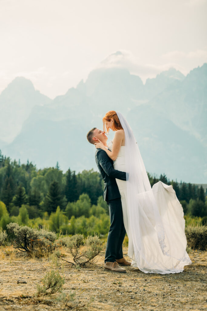 Bride and groom celebrating their Jackson Hole elopement with mountain views