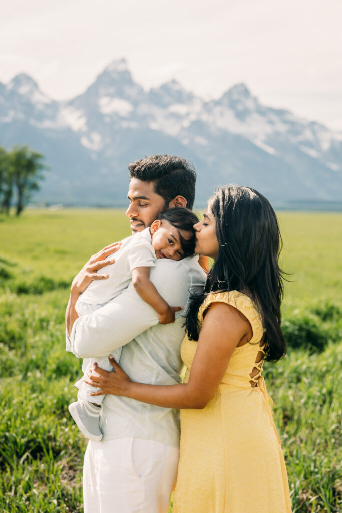 Parents laughing with their children during a Grand Teton National Park family photo session.