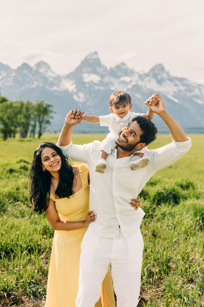 Parents laughing with their children during a Grand Teton National Park family photo session