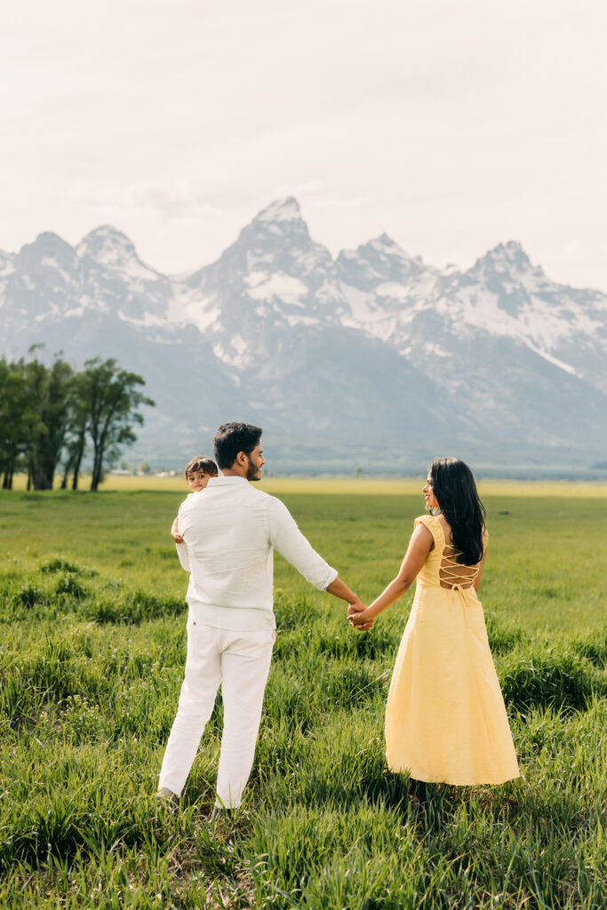 Parents laughing with their children during a Grand Teton National Park family photo session