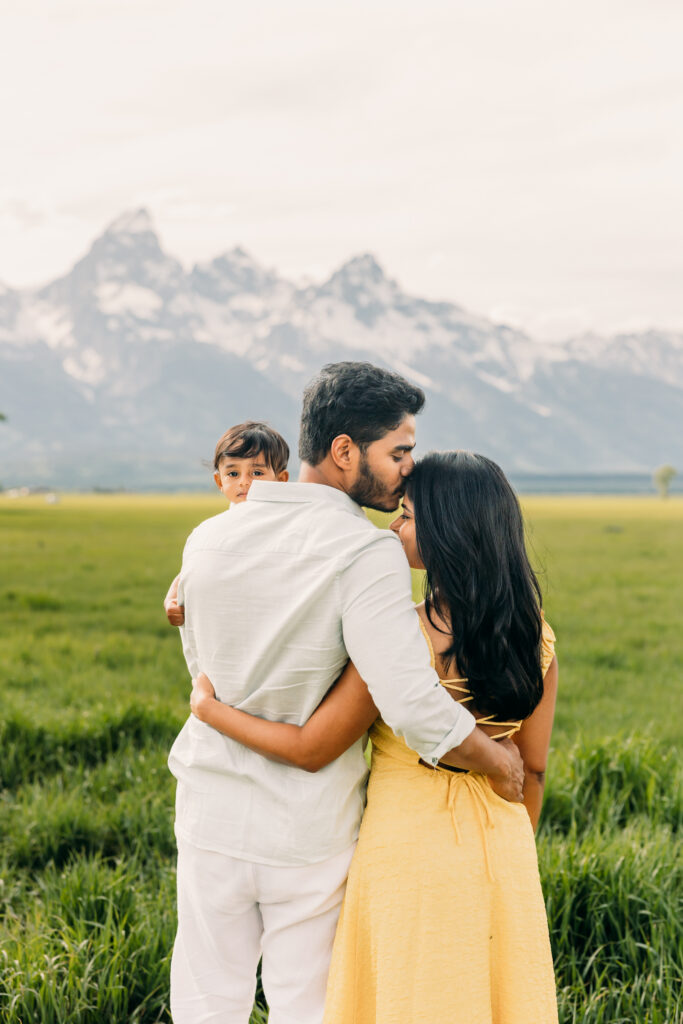 Parents laughing with their children during a Grand Teton National Park family photo session.