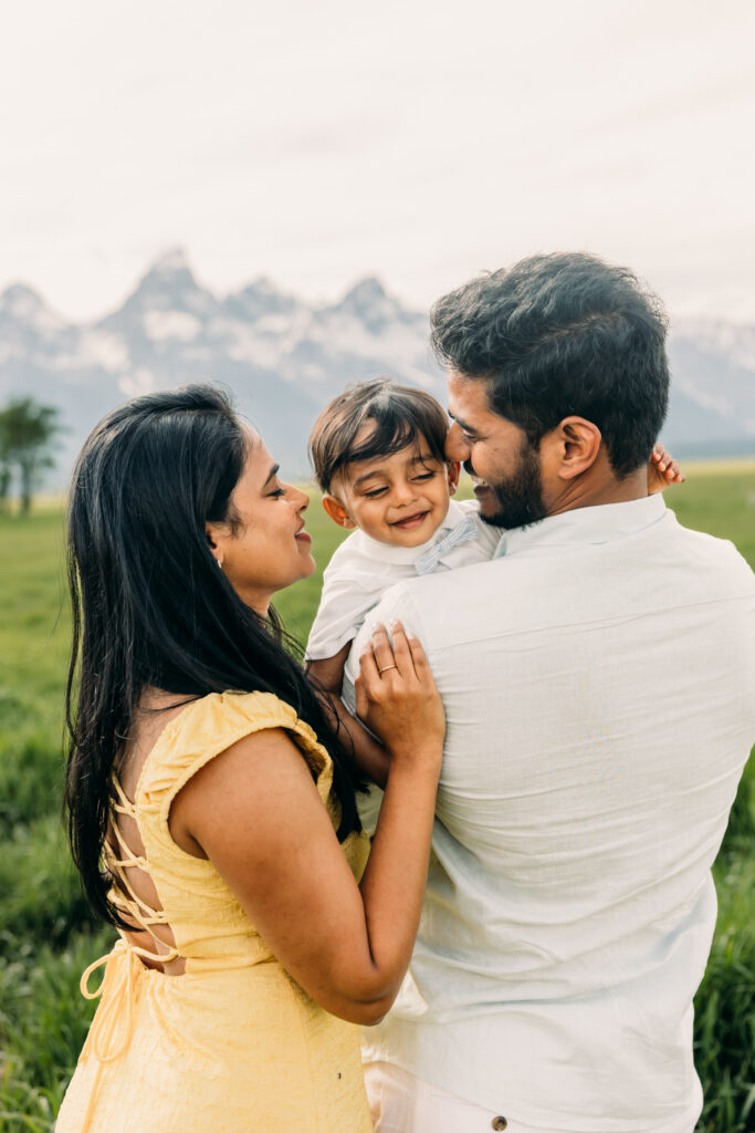 Parents laughing with their children during a Grand Teton National Park family photo session.