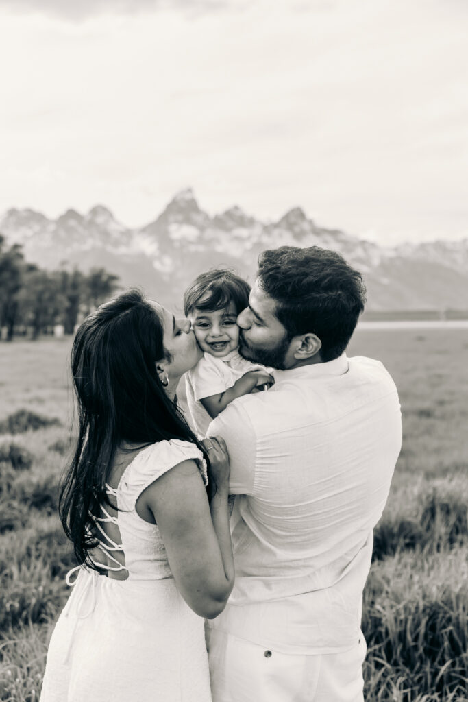 Parents laughing with their children during a Grand Teton National Park family photo session.