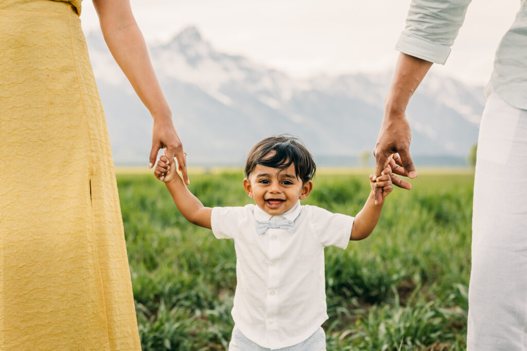 Parents laughing with their children during a Grand Teton National Park family photo session.