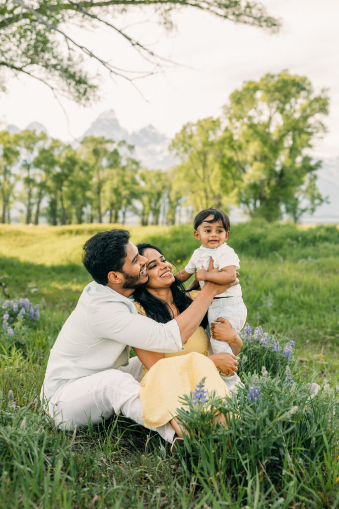 Parents laughing with their children during a Grand Teton National Park family photo session.