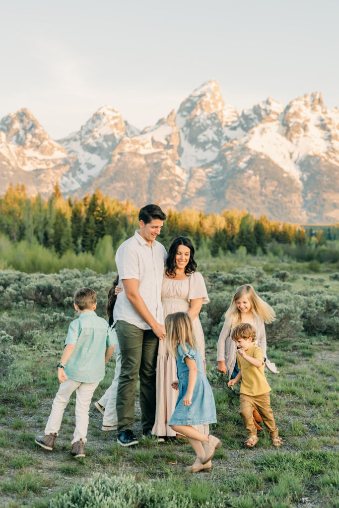 Sunrise at Grand Teton National Park family photo session family walking towards camera