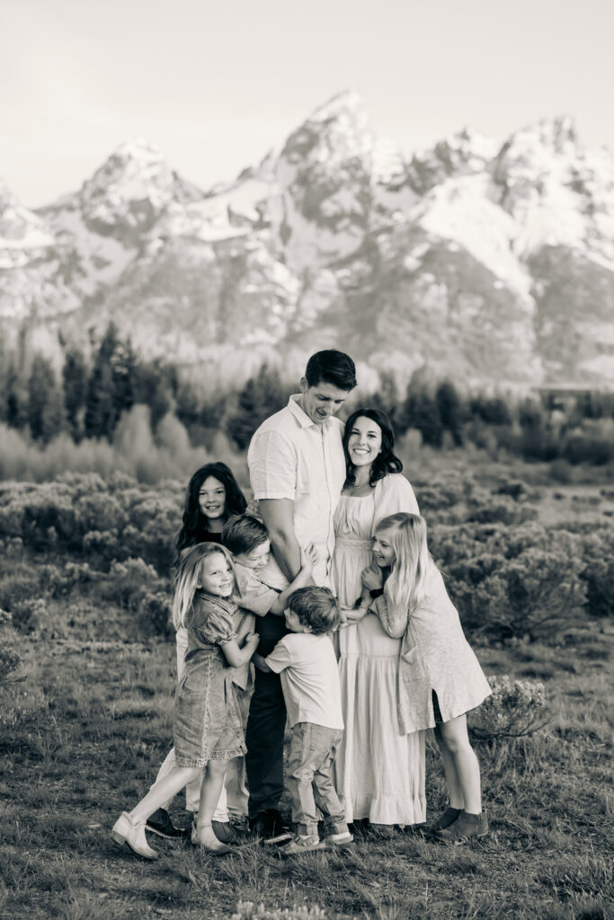 Sunrise at Grand Teton National Park family photo session family walking towards camera