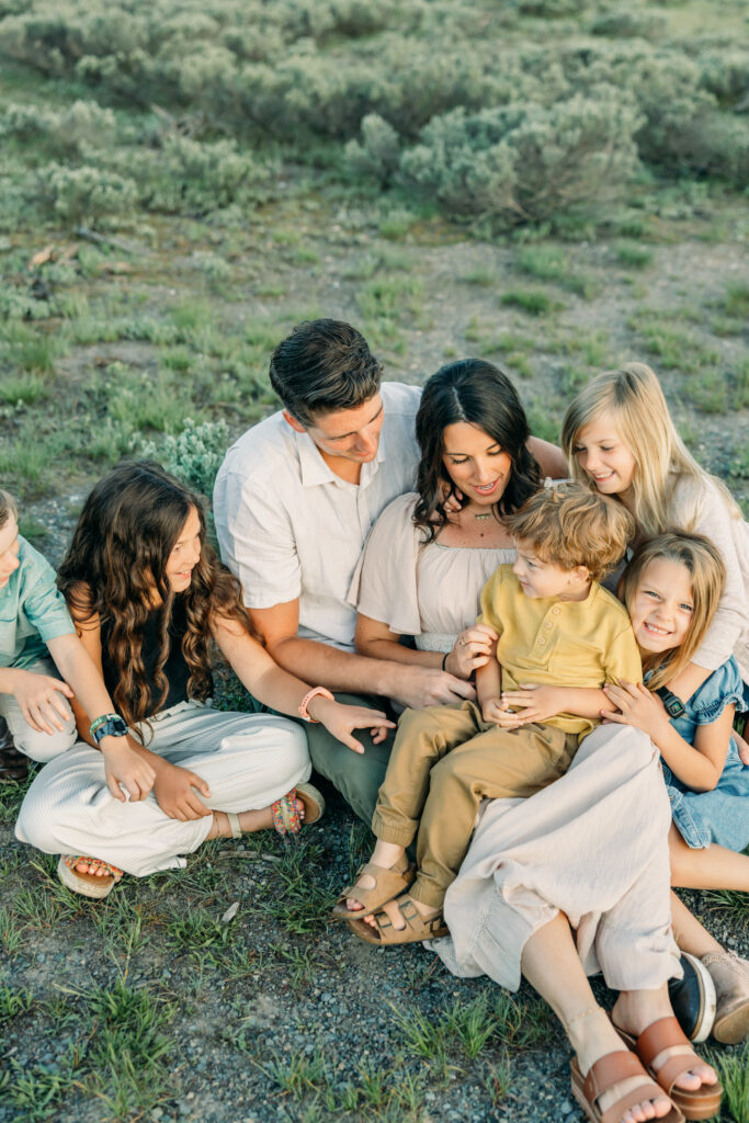 Schwabachers Landing family photo session family sitting down in meadow