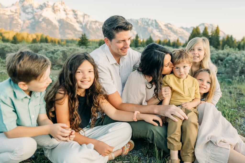 Schwabachers Landing family photo session family sitting down in meadow