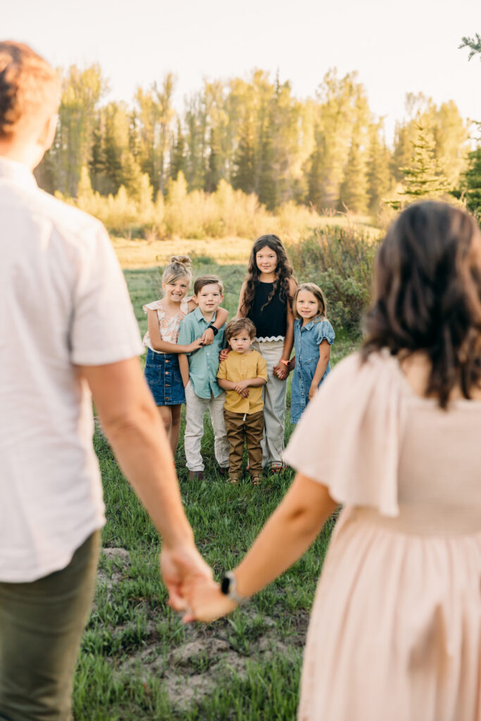 Grand teton family photographer tickling fight