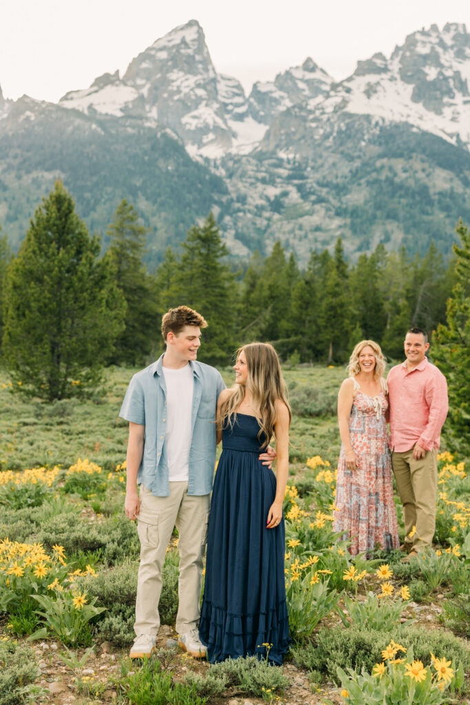 Sunset family photos with the Teton mountains in Grand Teton National Park in June with the sunflowers